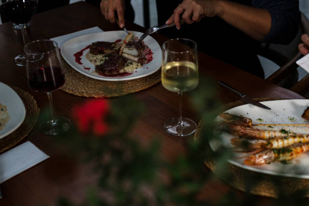 istock group of three people dining or having lunch in restaurant cafe drinking wine 2189345877