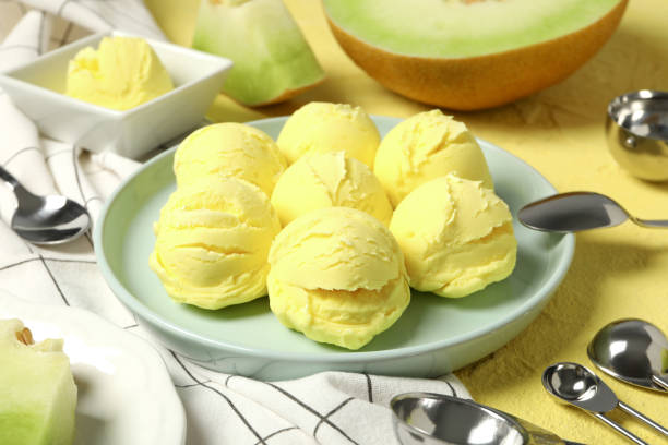 istock Ice cream scoops in a bowl with slices of fresh melon 2189346630
