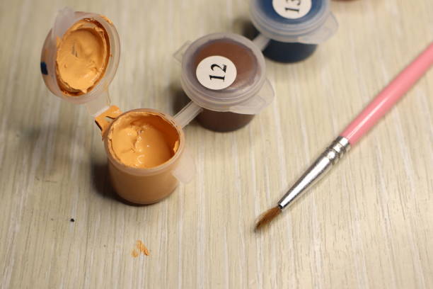 istock Art Supplies Acrylic Paints and Brush Set Ready for Use on the Creative Workspace 2189349404