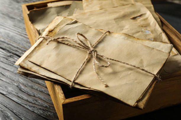 istock Box with old letters on wooden background, close up 2189351394