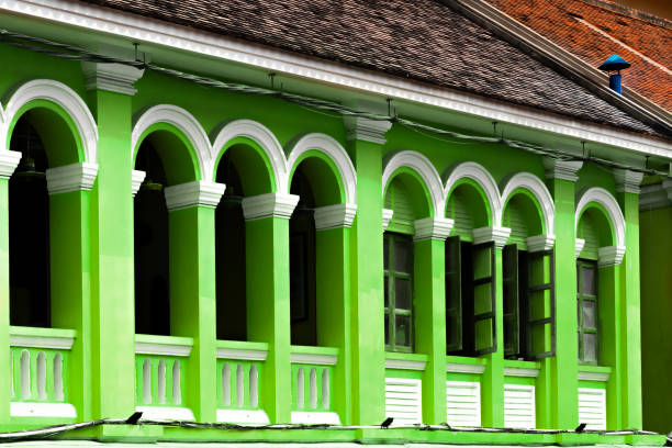 Architectural details of a green colonial building in Siem Reap, Cambodia
