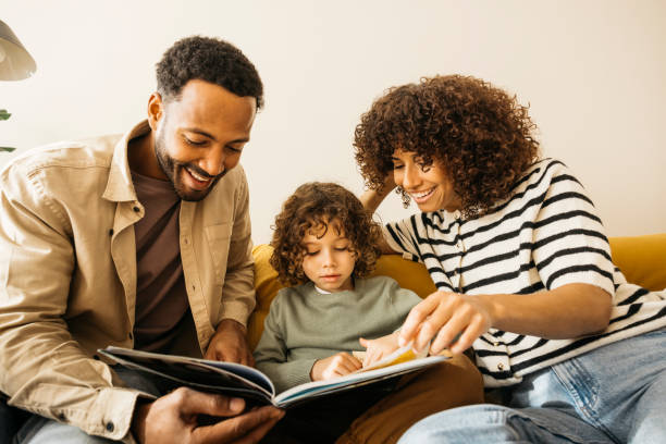 istock Loving parents reading and spending quality time with their child at home 2189355834