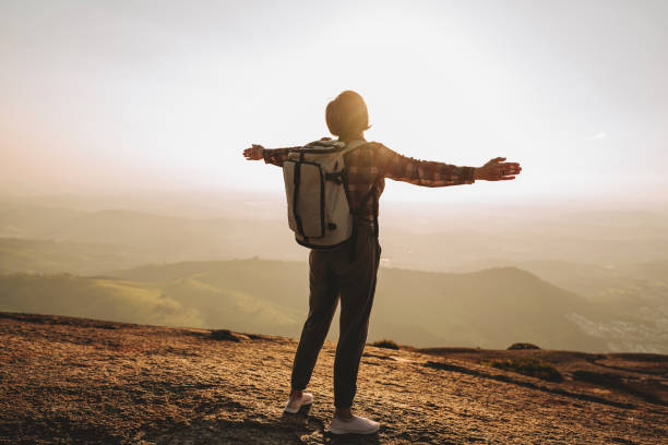 istock Woman on the mountain with open arms 2189356885