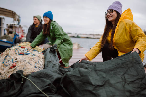 istock Fishermen preparing a boat for stormy weather 2189358252