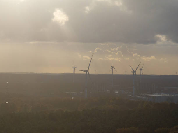istock Wind turbines generating green energy at sunset 2189358785