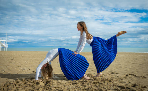 istock Two expressive dancers during a dance on the beach 2189360160
