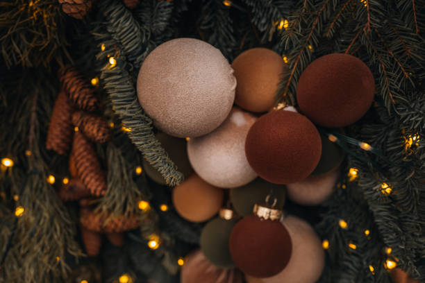 istock Creative New Year decorations velvet brown, green, beige balls and cone composition on the Christmas tree 2189361035