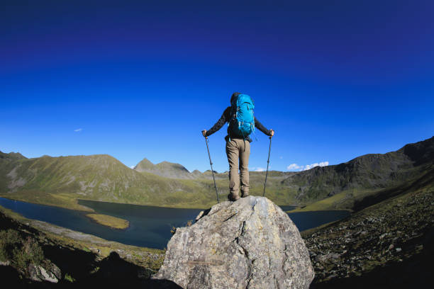 woman hiking on high altitude mountain top