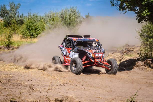 istock Outdoor activities UTV buggy moves on dusty road. 4x4, extreme, adrenalin. 2189362065
