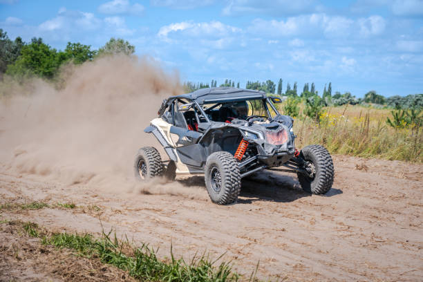 Extreme road conditions, difficult track for off-road vehicles, attempt to drive over a large obstacle with water, mud and sand on the track of an off-road car race