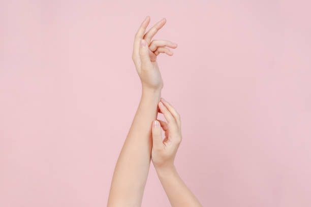 istock Manicured nails, beautiful woman hands forming an elegant shape on pink background 2189362329