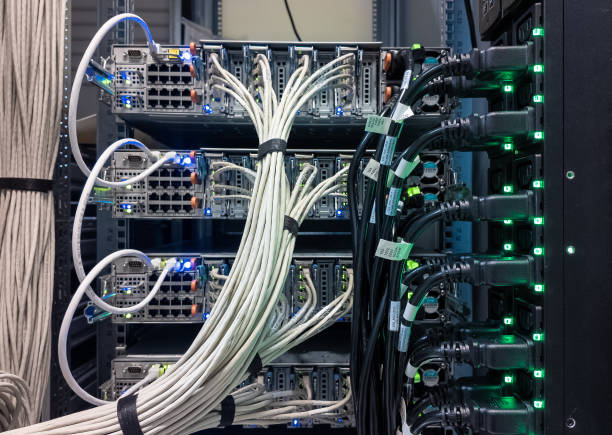 istock Data center equipment with organized cabling and illuminated ports providing network support 2189363078