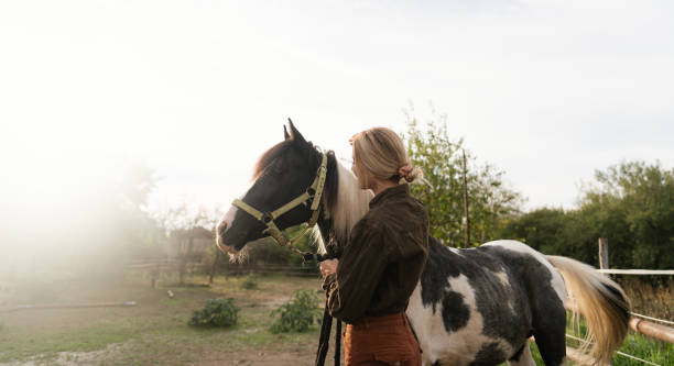 istock Gentle moment between a woman and her horse 2189363144