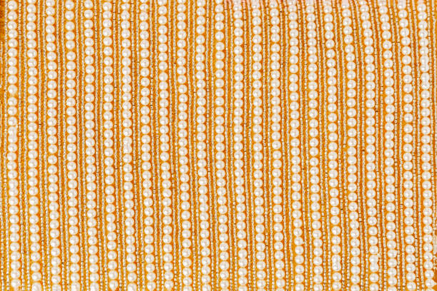 istock Beautiful golden beads fabric background 2189363728