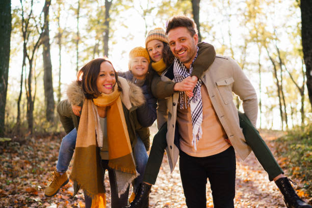 istock Parents carry their children on their backs in nature 2189365513