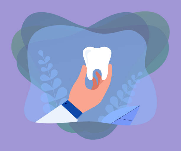 istock Hand of cartoon dentist holding big tooth 2189369874