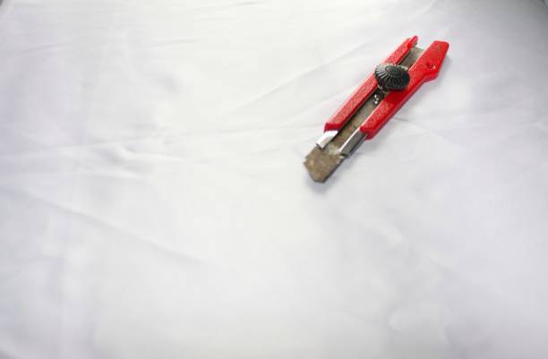Close up of rusted cutter isolated in a white background