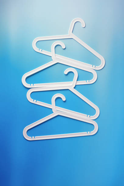 istock White Clothes hangers as creative minimal composition gradient background of blue color, Plastic racks creating modern and geometric aesthetic, top view photo vivid color, creative modern pattern 2189370610