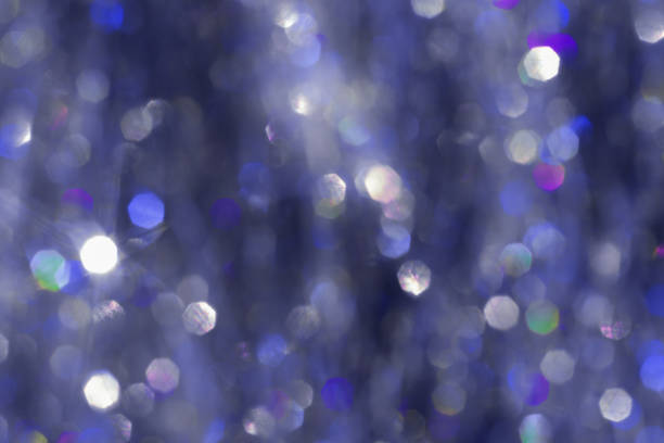 Abstract bokeh background blue colored background, natural glare from lights, white blue monochrome photo, gradient color, blurred bokeh texture as Glittering aesthetic textured pattern, future dusk