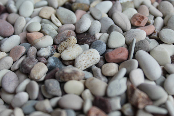 sunny polished pebbles create warm atmosphere, brightly polished gravel with cozy seaside charm