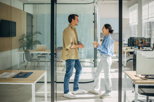 istock Joyful Exchange in Modern Office Surroundings 2189374602