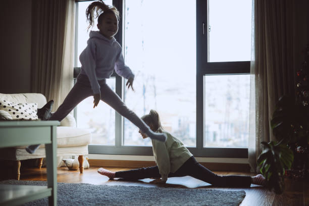 istock Playful children in living room 2189374639