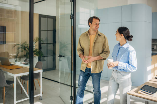 istock Cheerful Dialogue in Bright Office Landscape 2189374655