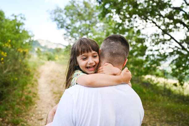 istock Father's Day. Father carrying little daughter. 2189374762