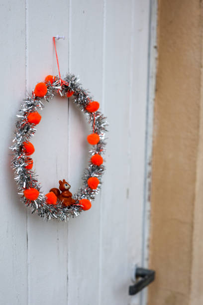 istock A holiday wreath with a small squirrel figurine 2189375168