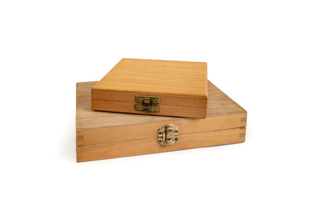 istock Wooden boxes with closed lid stacked and isolated on white background, abstract gift concept 2189375439