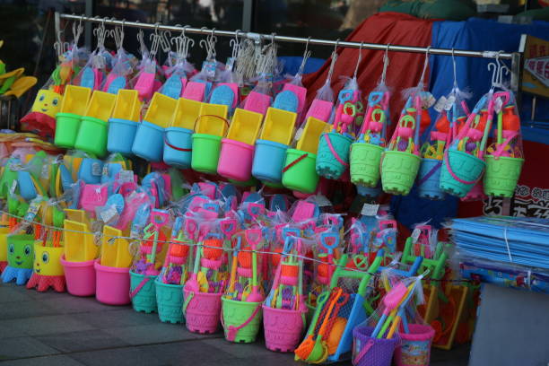 istock A colorful display of plastic buckets and shovels 2189377215