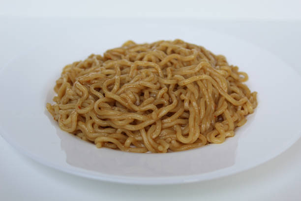 istock A serving of fried instant noodles, on white plate, isolated on white background 2189377343