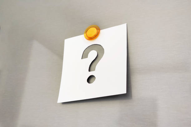istock Question mark on a notepaper attached with a magnet on a gray metal background 2189377717