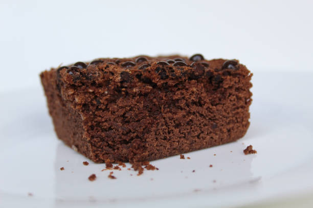 istock Square shape of brownies cake with choco chips topping, isolated on white background 2189378414