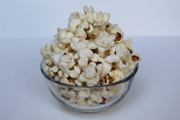 Close-Up Of four Popcorn Against a blue Background