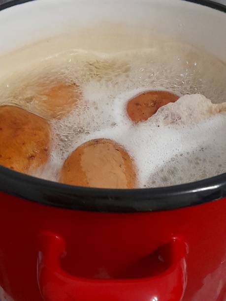 istock Boiled potatoes in water in cooking pot 2189380926
