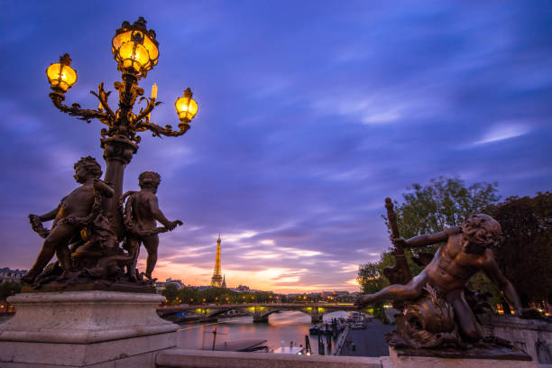 Beautiful evening in Paris with Eiffel Tower illuminated over the Seine River