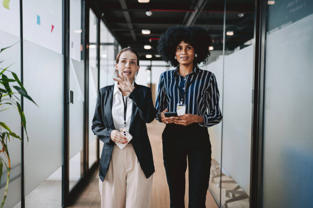 istock Employees walking down the company corridor 2189387265