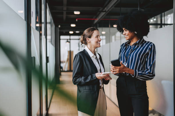 istock Employees walking down the company corridor 2189387273
