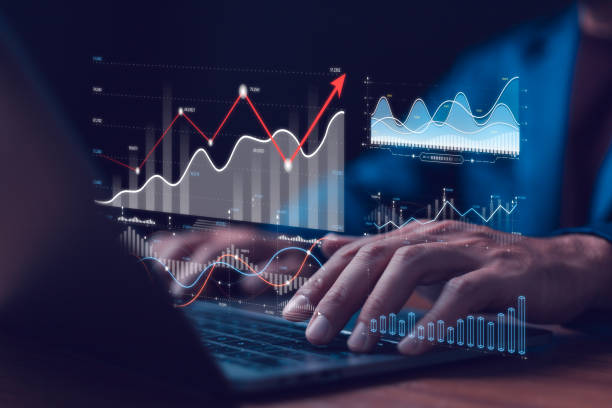 istock Businessman use AI analyzing data on laptop with futuristic graphs and charts, financial growth trends and analytics. Data analytics automated with AI technology. Dashboard report KPI insights. 2189388372