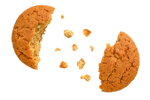 istock Oatmeal cookies broken in half with crumbs scattered chaotically. 2189388432