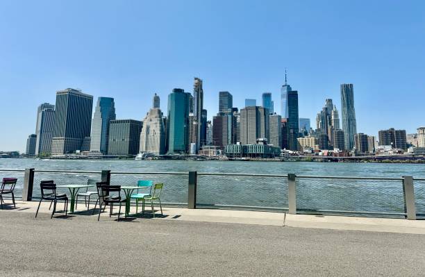 istock Picnic table at brooklyn along east river that can see midtown manhattan skyscraper skyline . 2189389554