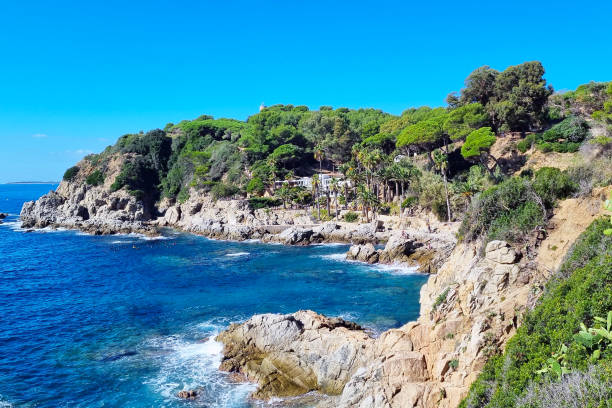 istock Coastal Serenity: Vibrant Mediterranean Landscape with Rocky Shoreline and Lush Greenery 2189390755