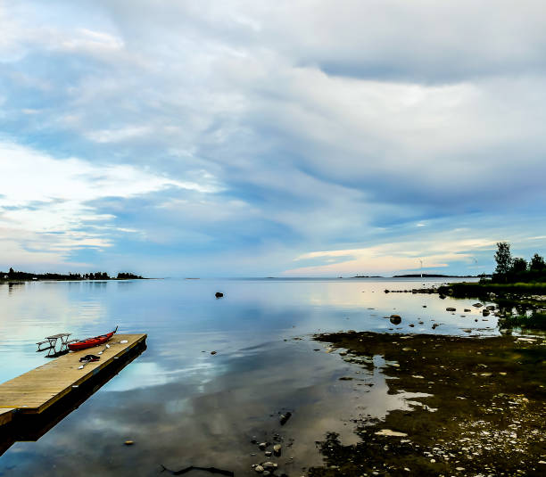 istock A calm lake with a dock and a kayak on it 2189391774