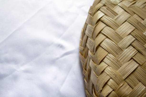 close up of woven bamboo with white background