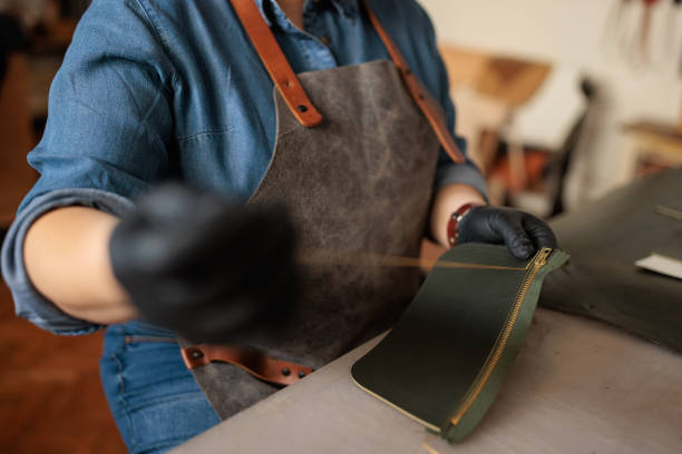 istock Skilled Craftswoman Sewing a Handmade Leather Wallet 2189394951
