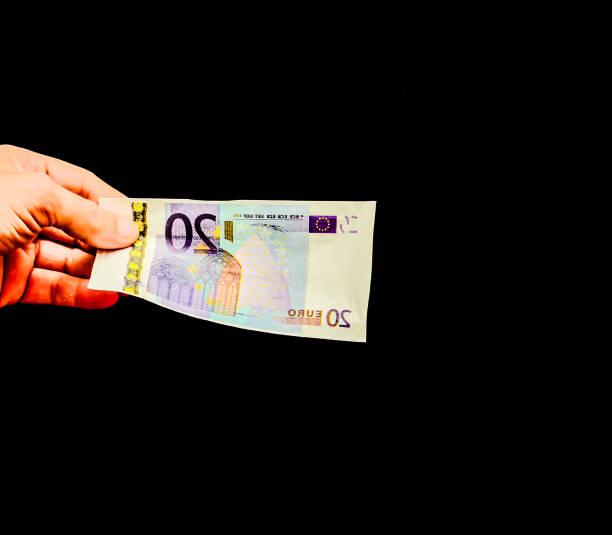 istock A hand is holding a 20 euro bill 2189395129