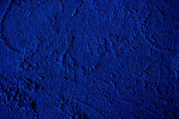 Blue colored abstract wall background with textures of different shades of blue
