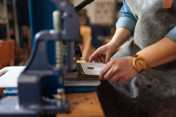 istock Skilled Craftswoman Engraving Leather Wallet 2189398247