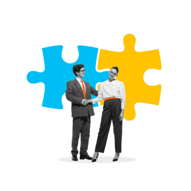 istock Two business professionals shaking hands with puzzle pieces in background, representing partnership and collaborative problem-solving. Conceptual design. 2189399488